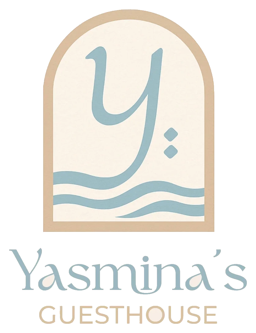 Yasmina's Guesthouse identity mark, arched window with a stylised Y over waves